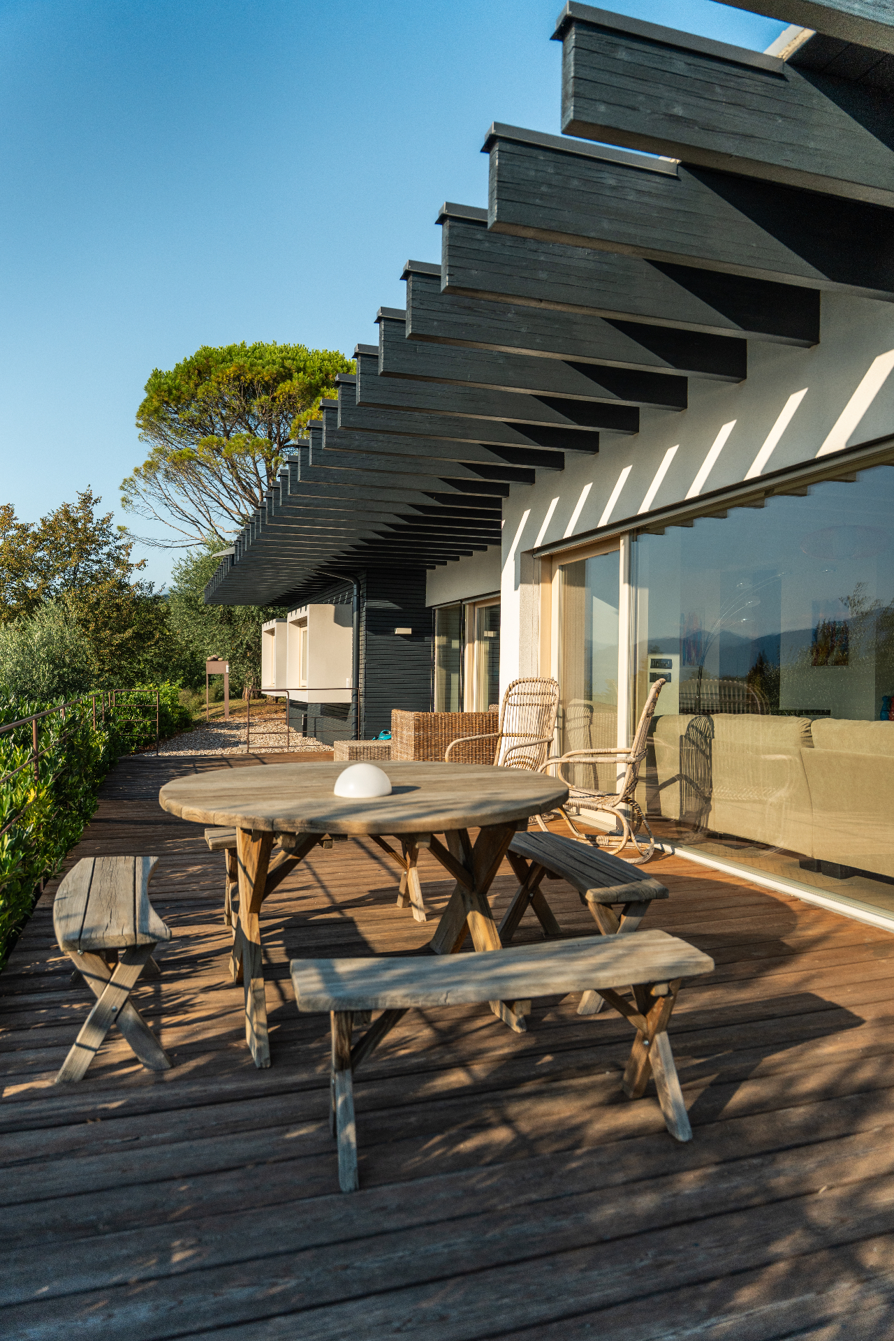 Terrace deck with picnic table under the pergola