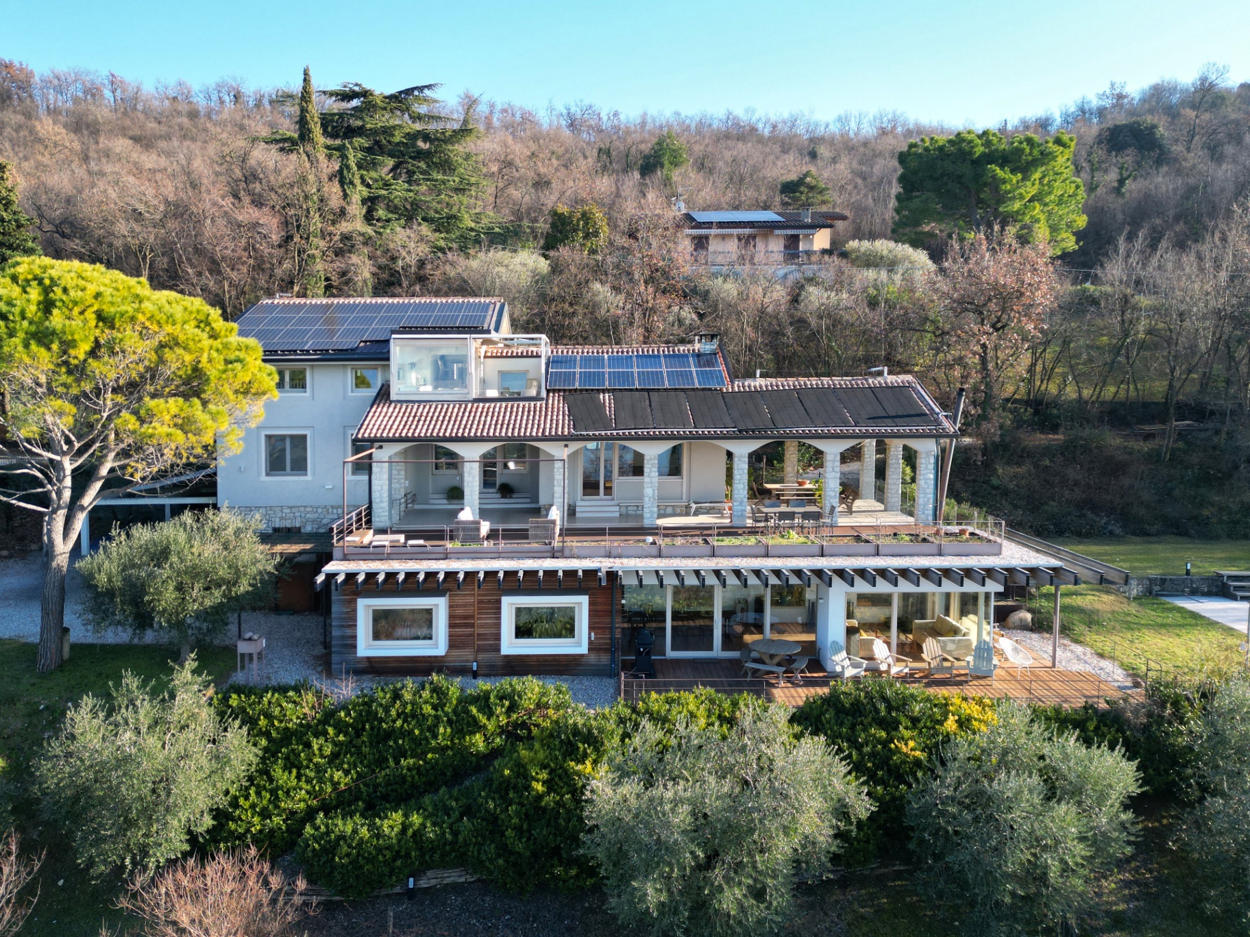 Villa exterior — colonnade, terraces and solar roof